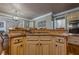 Custom kitchen island featuring granite countertops, lots of cabinets, stainless steel appliances, and hardwood floors at 4780 Woodruff Trce, Cumming, GA 30028