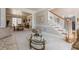 Cozy living room view leading to the staircase and formal dining area with bright, neutral tones at 4780 Woodruff Trce, Cumming, GA 30028