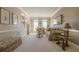 Inviting living room boasting traditional decor, a staircase, and sun-filled windows at 4780 Woodruff Trce, Cumming, GA 30028