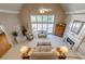 High angle living room view with vaulted ceilings, fireplace, furniture, and staircase at 4780 Woodruff Trce, Cumming, GA 30028