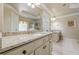 Double granite countertop vanity offers an abundance of space in this gorgeous spa-like ensuite bathroom at 4780 Woodruff Trce, Cumming, GA 30028