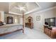 A spacious and airy bedroom with tray ceilings, and plush neutral carpets, perfect for relaxation at 4780 Woodruff Trce, Cumming, GA 30028