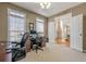 Spacious office with large windows for natural light and an open doorway to the foyer at 4780 Woodruff Trce, Cumming, GA 30028