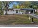 Charming brick home with front yard, painted white with black trim at 1066 Cleavemark Dr, Clarkston, GA 30021