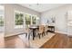 Elegant dining room with hardwood floors, natural light, and a stylish table set for a meal at 1112 Central Park Rd, Decatur, GA 30033