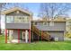 Spacious backyard featuring a raised deck and stairs at 2330 Lago Dr, Jonesboro, GA 30236
