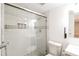 Bathroom with sliding glass shower door and decorative shower tiling at 2330 Lago Dr, Jonesboro, GA 30236