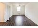 Bedroom with dark wood floors, white walls and natural light at 2330 Lago Dr, Jonesboro, GA 30236