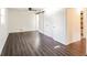 Open bedroom with dark wood floors, white walls and natural light at 2330 Lago Dr, Jonesboro, GA 30236