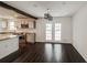 Modern kitchen features stainless steel appliances, granite countertops and dark wood flooring at 2330 Lago Dr, Jonesboro, GA 30236