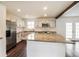 Modern kitchen features stainless steel appliances, granite countertops and dark wood flooring at 2330 Lago Dr, Jonesboro, GA 30236