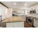 Eat in kitchen features stainless steel appliances, granite countertops and dark wood flooring at 2330 Lago Dr, Jonesboro, GA 30236