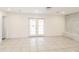 Bright living room with tile floors and French doors, perfect for entertaining guests at 2330 Lago Dr, Jonesboro, GA 30236
