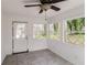 Bright sunroom features tile floors, white walls and windows with natural light at 2330 Lago Dr, Jonesboro, GA 30236