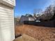 Backyard with wooden fence, grass, and view of the home at 2716 Wynford Sw Ave, Marietta, GA 30064