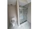 Bathroom featuring a new marble shower and modern toilet at 2716 Wynford Sw Ave, Marietta, GA 30064