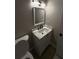 Modern bathroom featuring an updated vanity with a marble countertop and sleek black fixtures at 2716 Wynford Sw Ave, Marietta, GA 30064