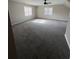 Spacious bedroom featuring plush gray carpeting and dual windows for plenty of natural light at 2716 Wynford Sw Ave, Marietta, GA 30064