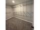 Spacious walk-in closet featuring wire shelving and carpeted floor at 2716 Wynford Sw Ave, Marietta, GA 30064