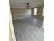 Open dining room featuring gray luxury vinyl plank flooring, wainscotting, and natural light from multiple windows at 2716 Wynford Sw Ave, Marietta, GA 30064