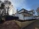 Attractive home featuring a welcoming porch and professional landscape retaining wall at 2716 Wynford Sw Ave, Marietta, GA 30064