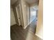 Hallway with gray flooring, trim, and views into living space at 2716 Wynford Sw Ave, Marietta, GA 30064