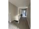 Upstairs hallway with modern wood-look flooring and white painted railings at 2716 Wynford Sw Ave, Marietta, GA 30064