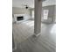 Bright living room featuring a decorative fireplace, with gray luxury vinyl plank flooring at 2716 Wynford Sw Ave, Marietta, GA 30064