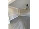 Bright living room with gray floors, neutral walls, white trim, and modern black light fixture at 2716 Wynford Sw Ave, Marietta, GA 30064