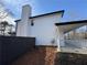 Side view showing a fenced-in yard and covered patio at 2716 Wynford Sw Ave, Marietta, GA 30064