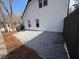 Side yard with gravel covering, exterior white siding with black trim, and a partial view of a truck at 2716 Wynford Sw Ave, Marietta, GA 30064