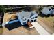 Aerial view of a traditional two-story home with a manicured lawn and a two-car garage at 3280 Spincaster Way, Loganville, GA 30052