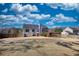 Spacious backyard offers ample room for outdoor activities and features a wooden deck at 3280 Spincaster Way, Loganville, GA 30052