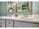 Close-up of the bathroom vanity with dual sinks and framed mirrors at 3280 Spincaster Way, Loganville, GA 30052