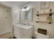 Bathroom with marble top vanity and toilet at 3280 Spincaster Way, Loganville, GA 30052