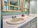 Close-up of the bathroom vanity with dual sinks and framed mirrors at 3280 Spincaster Way, Loganville, GA 30052