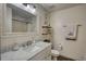 Bright bathroom featuring new marble vanity top, framed mirror and upgraded fixtures at 3280 Spincaster Way, Loganville, GA 30052