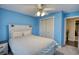 Cozy bedroom featuring a ceiling fan, carpet, and ample natural light at 3280 Spincaster Way, Loganville, GA 30052