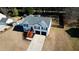 Two-story home featuring a two-car garage and backyard with a play area and a soccer net at 3280 Spincaster Way, Loganville, GA 30052