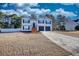 Traditional two-story home with a well-maintained lawn and a two-car garage at 3280 Spincaster Way, Loganville, GA 30052