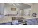 Modern kitchen with stainless steel oven and granite countertops at 3280 Spincaster Way, Loganville, GA 30052
