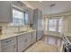 This updated kitchen has stainless steel appliances and granite countertops overlooking a dining room at 3280 Spincaster Way, Loganville, GA 30052