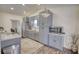 Well-lit kitchen features gray cabinets, granite countertops, and stainless steel appliances at 3280 Spincaster Way, Loganville, GA 30052