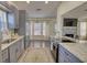 Updated kitchen boasts stainless steel appliances and ample cabinet space with an open dining room at 3280 Spincaster Way, Loganville, GA 30052