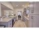 Well-lit kitchen features granite countertops and stainless steel appliances at 3280 Spincaster Way, Loganville, GA 30052