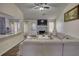 Cozy living room featuring a gray fireplace, dark floors and neutral sectional sofa at 3280 Spincaster Way, Loganville, GA 30052