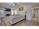 Spacious living room has dark floors, fireplace, and gray sectional at 3280 Spincaster Way, Loganville, GA 30052