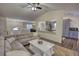 Bright, open living room with vaulted ceiling and comfortable seating arrangement with modern decor at 3280 Spincaster Way, Loganville, GA 30052