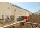View of multiple back porches offering outdoor space on tan townhouses at 5352 Beaver Br, Norcross, GA 30071