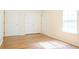 Bright bedroom with a large window, wood-look floors and ample closet space at 5352 Beaver Br, Norcross, GA 30071